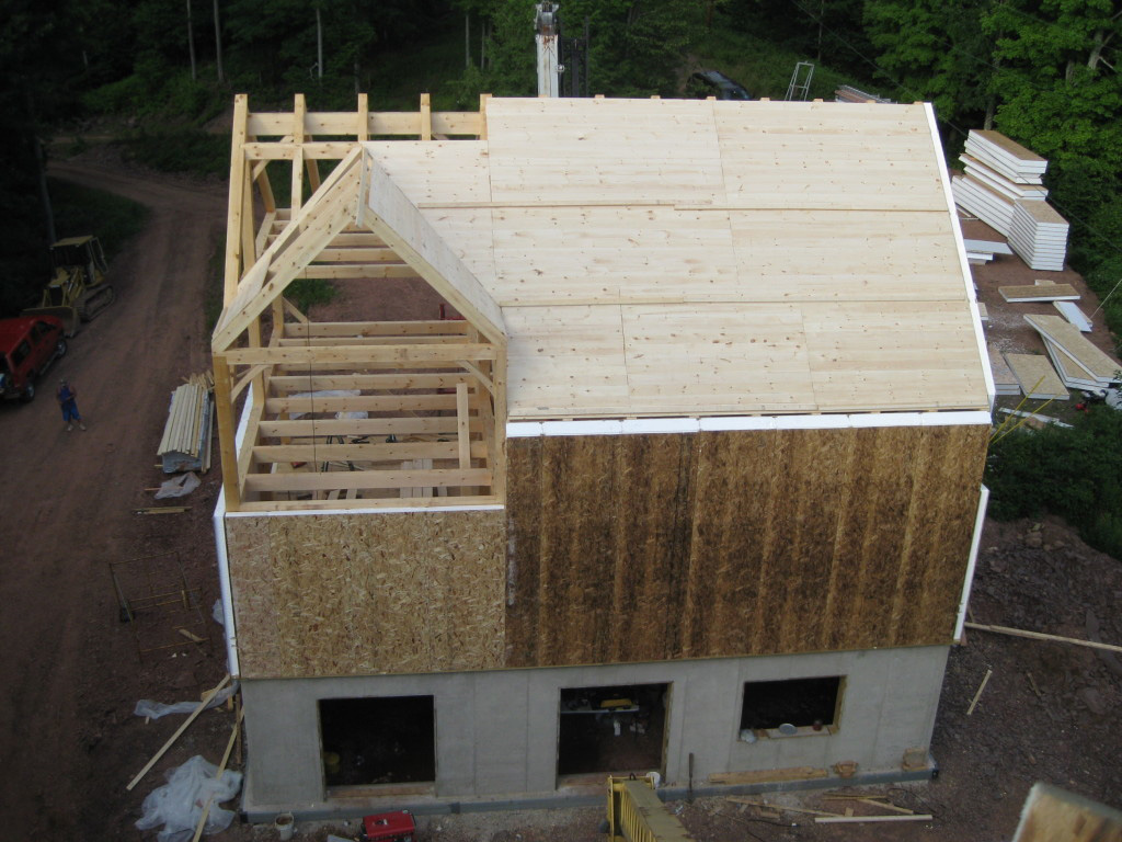 drone shot of SIPs being installed on a timber frame exterior