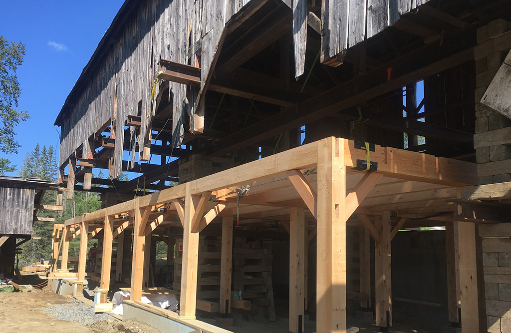 Timber frame installed to support the bottom an old Vermont barn