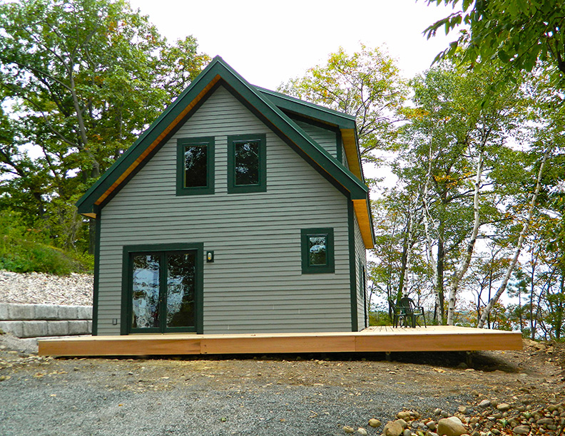 Finished exterior and porch of a timber frame camp