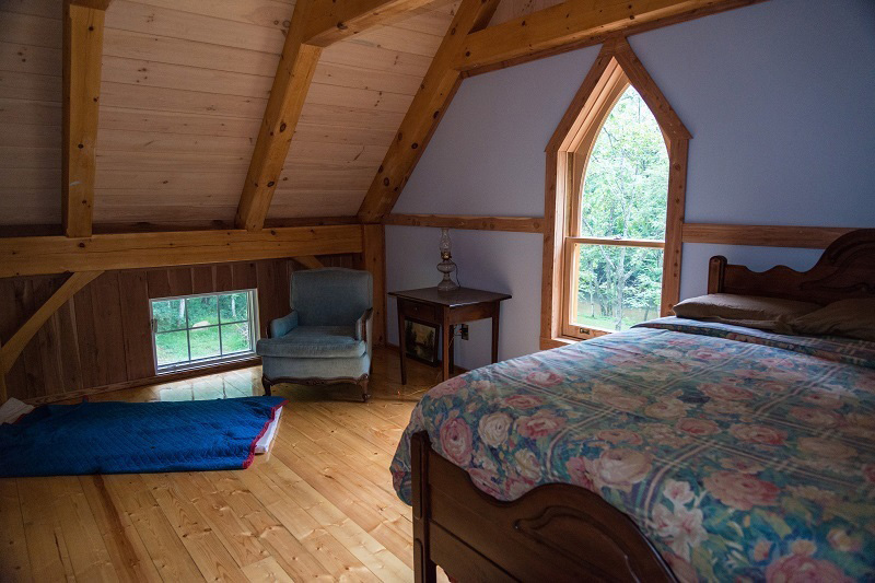 Bedroom in a timber frame camp
