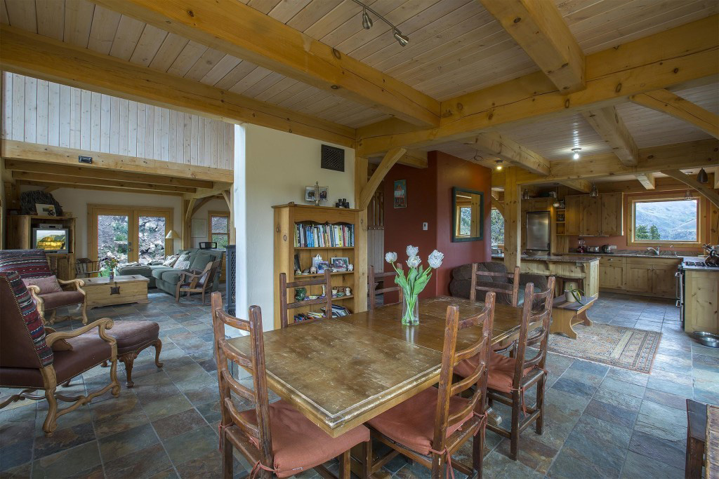 Kitchen, living room, and dining room in a timber frame cape