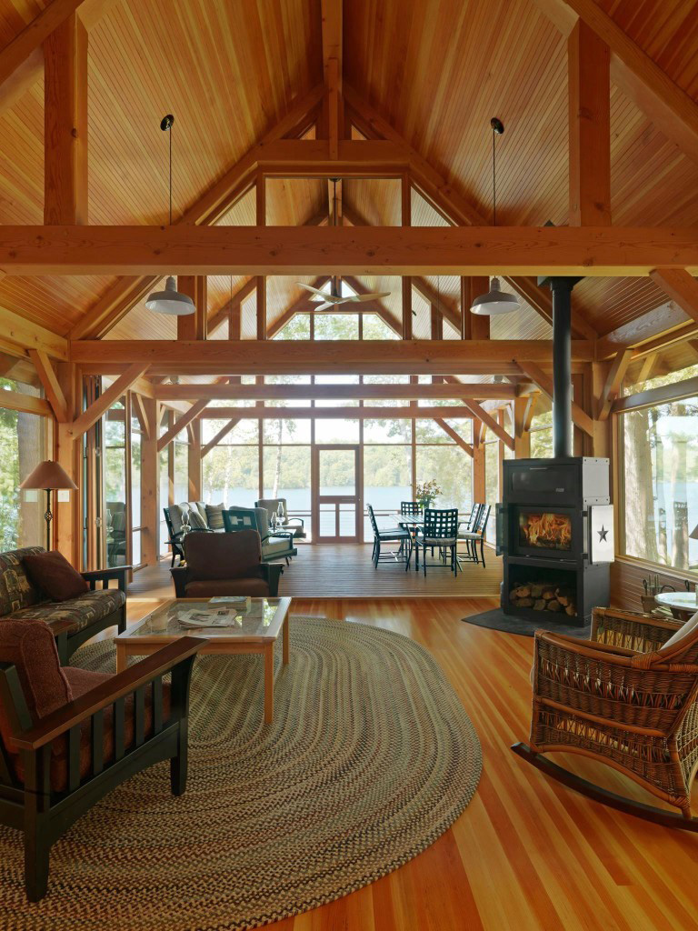 Kitchen and living room in a timber frame cape