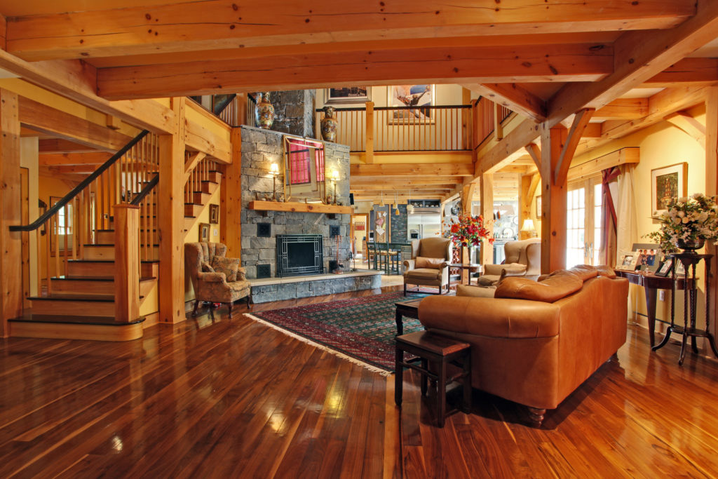 Living room and staircase to the second floor in a timber frame colonial