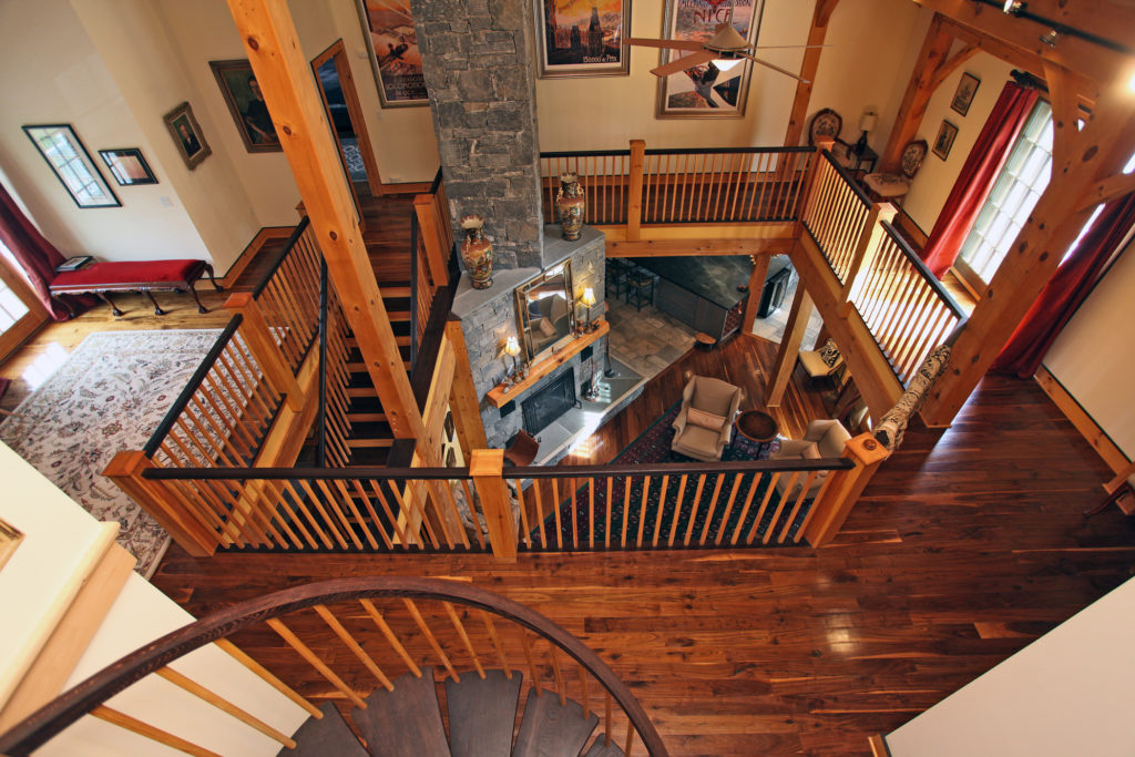 Looking down on the second and first floor in a timber frame colonial