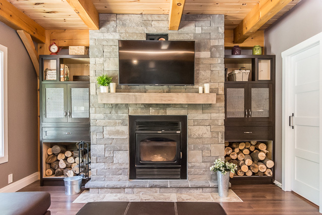 Stone fireplace in a timber frame dutch saltbox