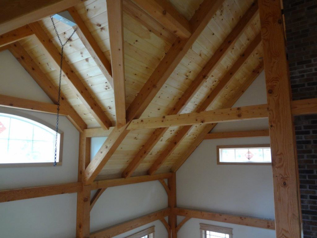 Interior ceiling beams in a timber frame dutch saltbox