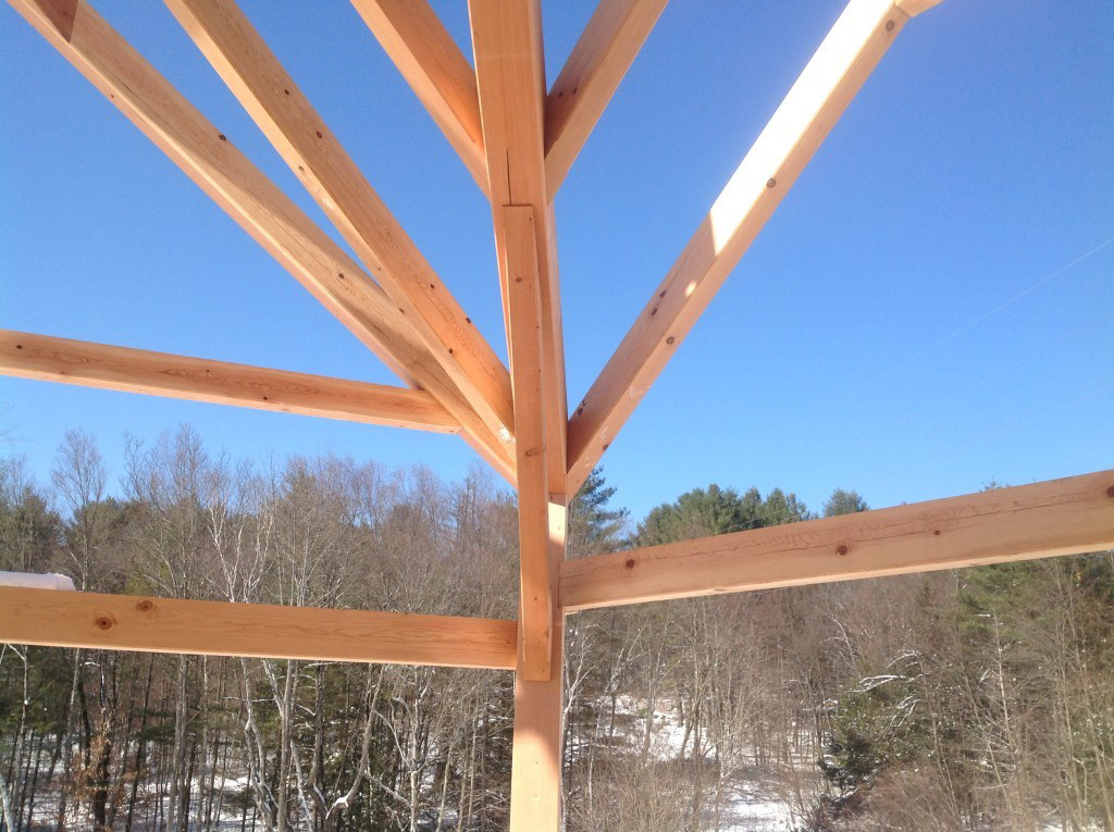 Close of of the beams in a timber frame dutch saltbox structure