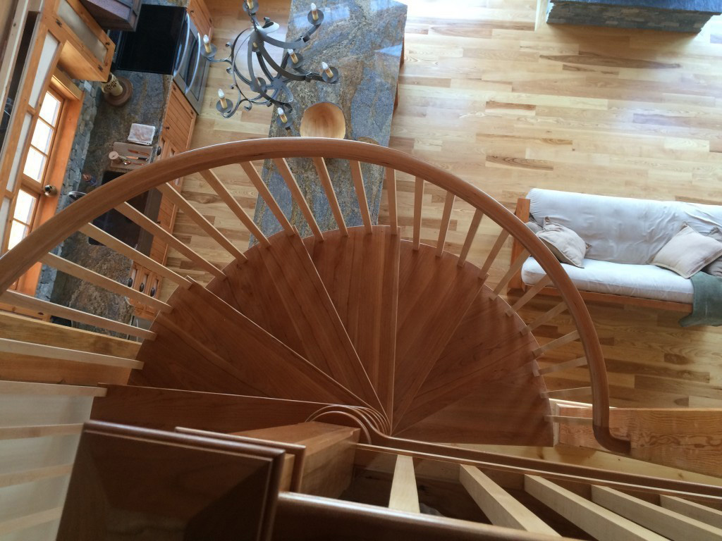 Spiral staircase in a timber frame dutch saltbox