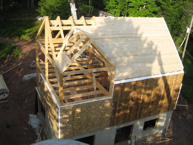 Overhead shot of a timber frame dutch saltbox structure with sides