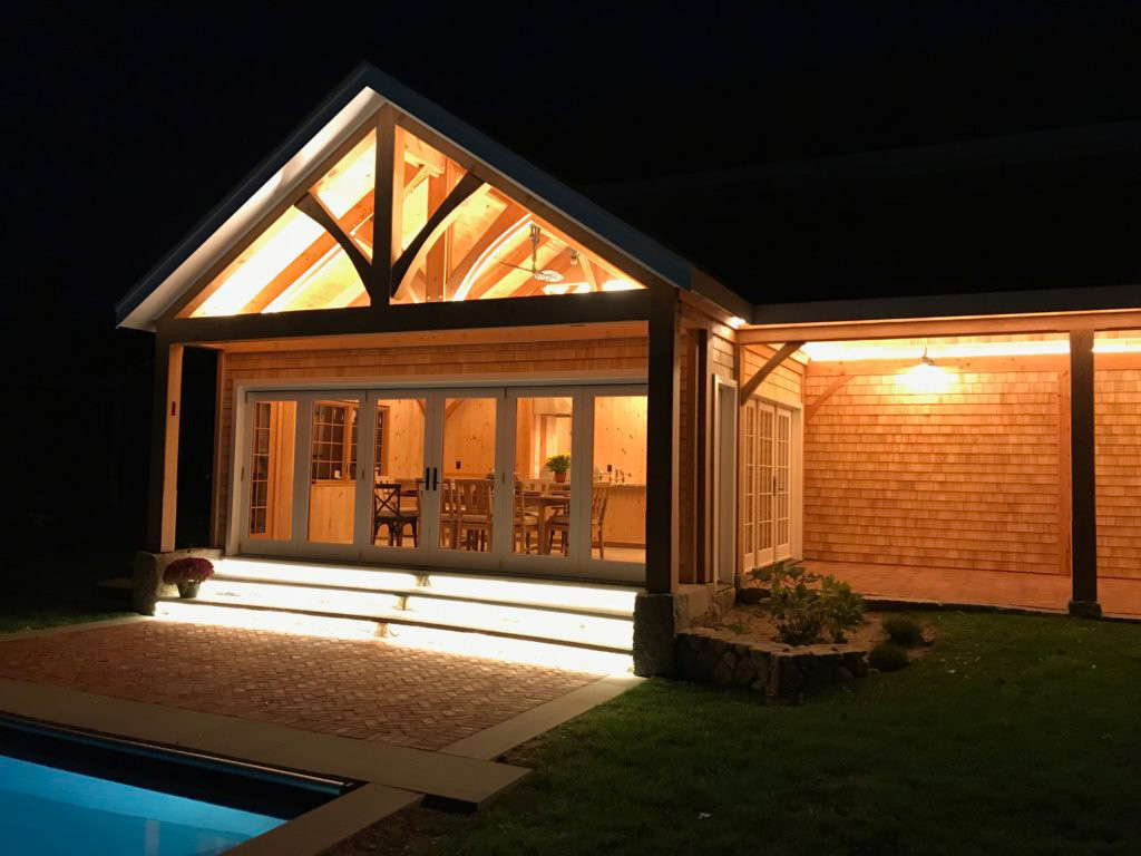 Finished exterior of a timber frame pavilion at night