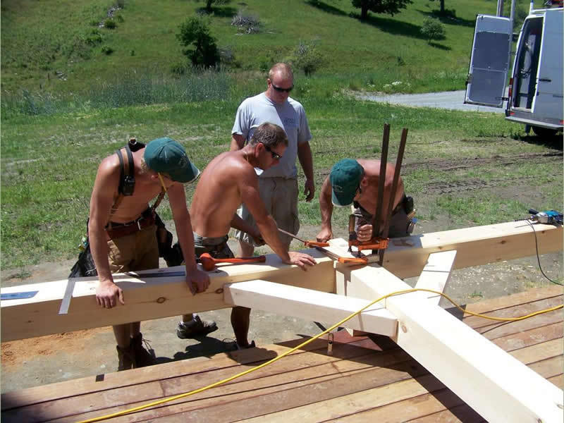 Assembling the porch beams of a timber frame restaurant