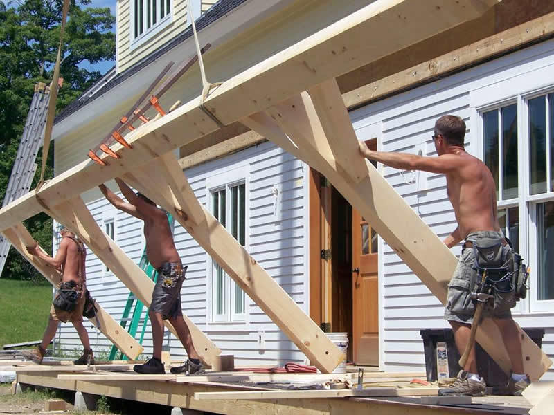 Assembling the porch of a timber frame restaurant
