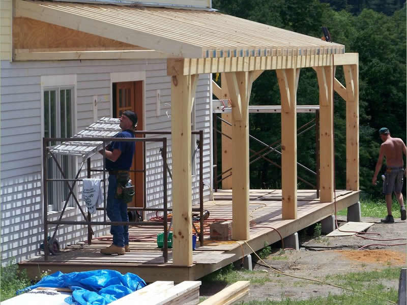 Assembling the porch of a timber frame restaurant