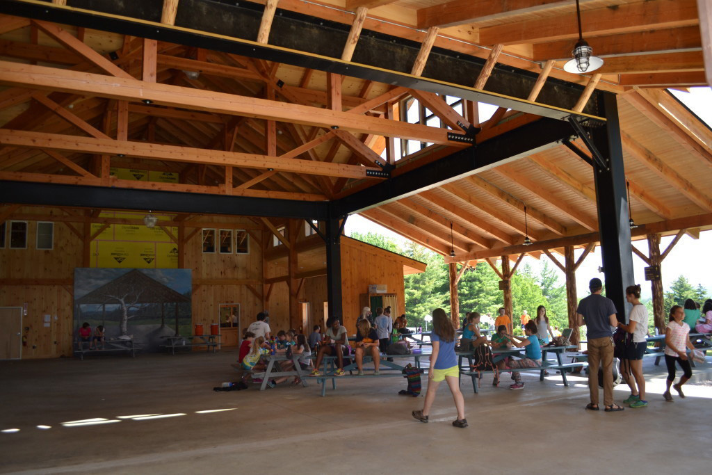 Finished interior of a timber frame summer camp pavilion