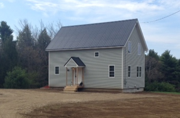 Finished exterior of a timber frame cape