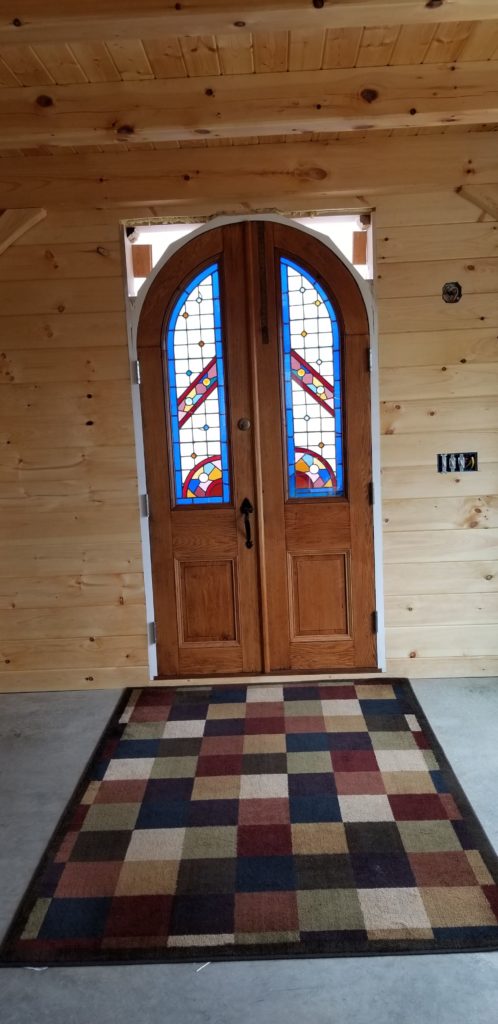 Finished interior doorway of a timber frame camp