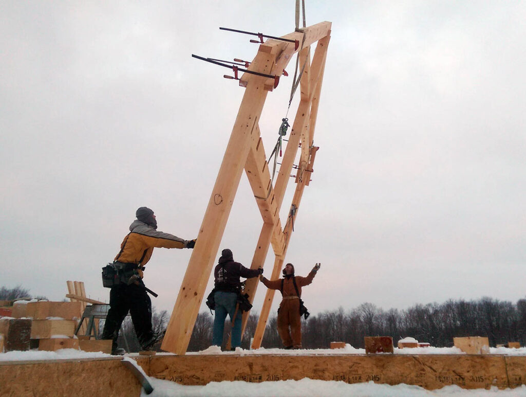 Raising a timber frame with a crane